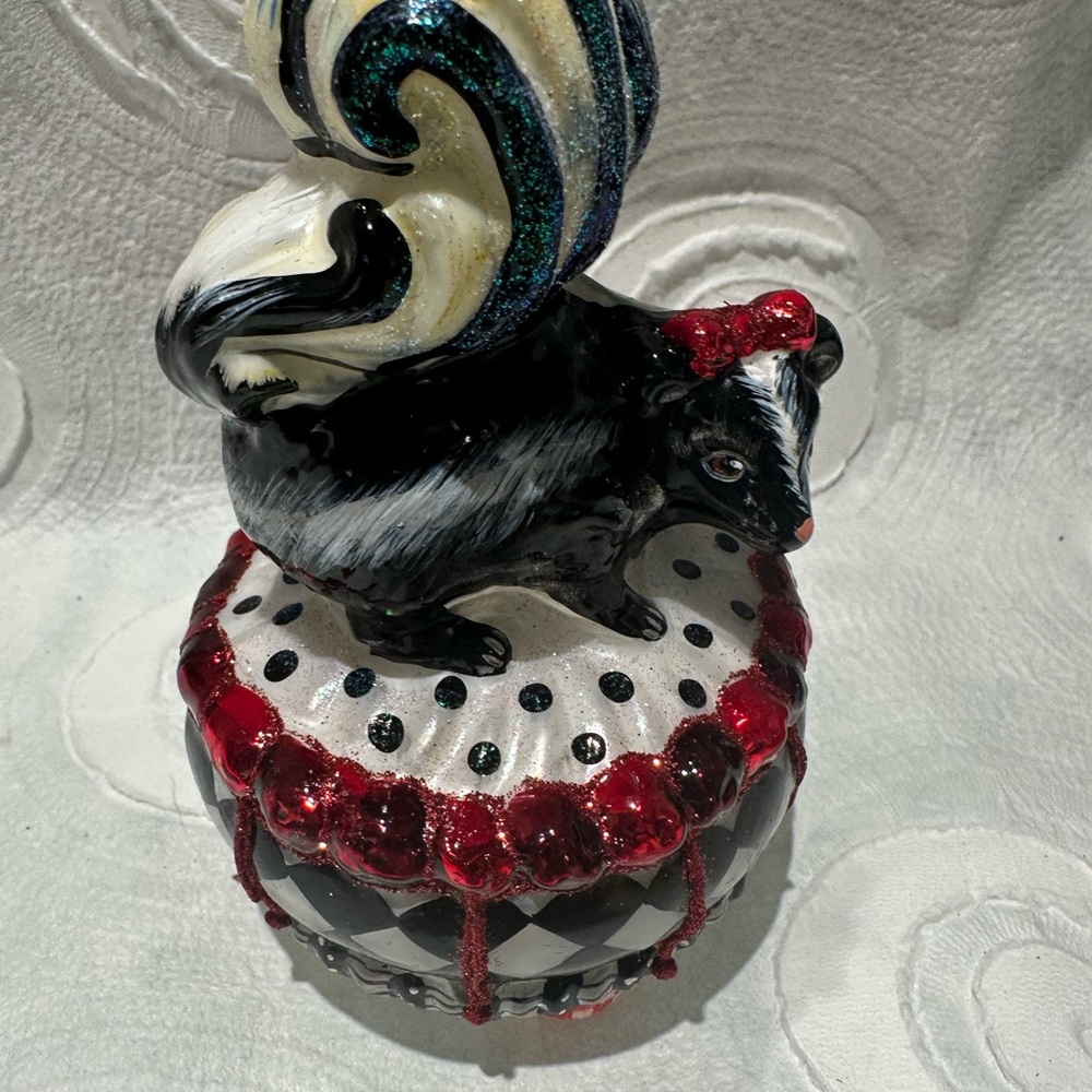MacKenzie-Childs Glass Black and White Skunk Ornament with Red Accents - Picture 6 of 7